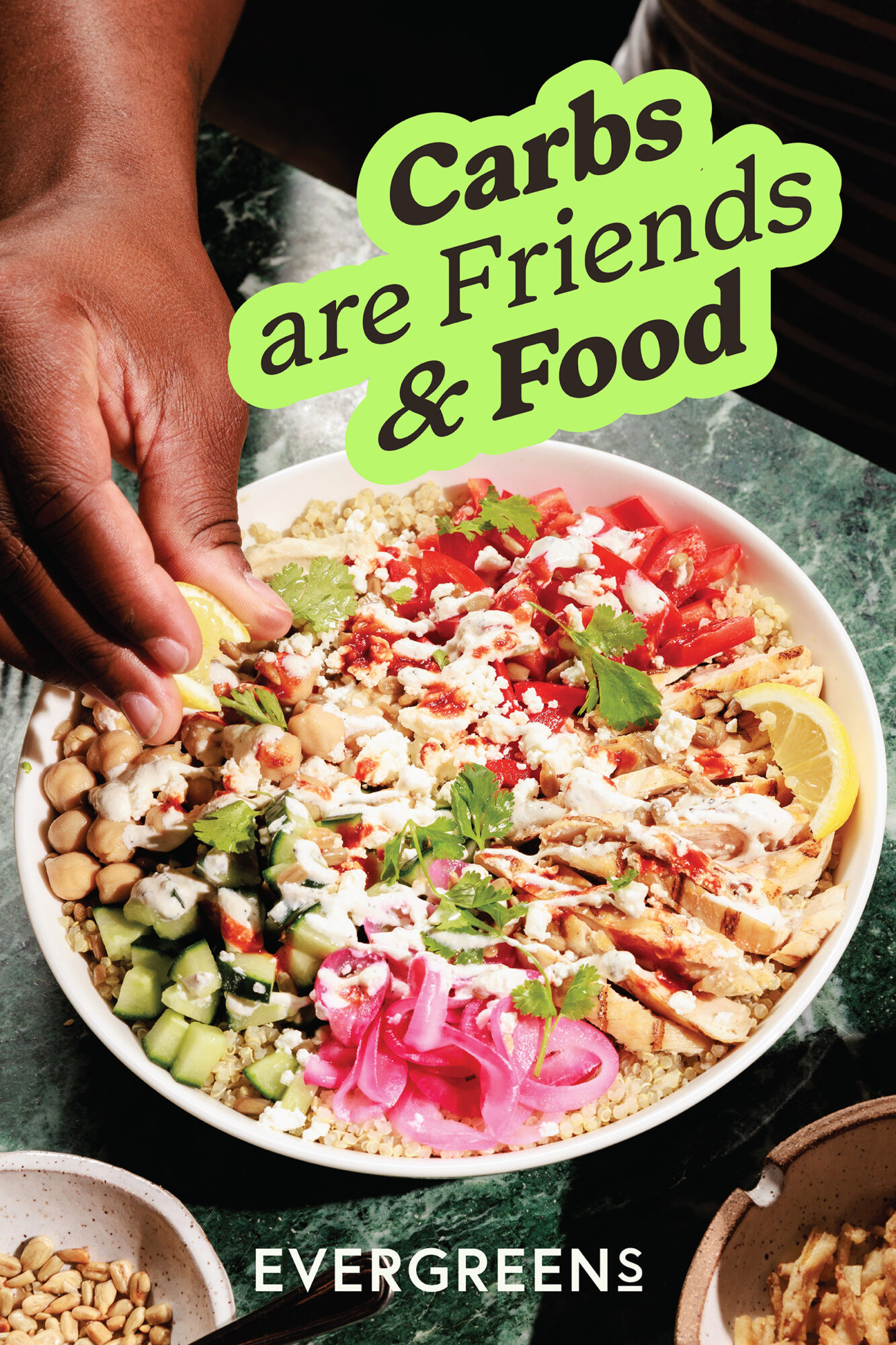 Seattle's best commercial food and hospitality photographer A hand squeezes a lemon wedge over a vibrant salad of tomatoes, cucumbers, chickpeas, pickled onion, and grains. Captured by Seattles best commercial food lifestyle photographer. Text reads, Carbs are Friends & Food. The EVERGREENS logo appears at the bottom. captured by seattle's best food and lifestyle photographer Brooke Fitts
